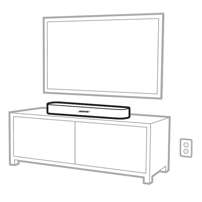 Bose TV speaker placed on furniture in front of a TV