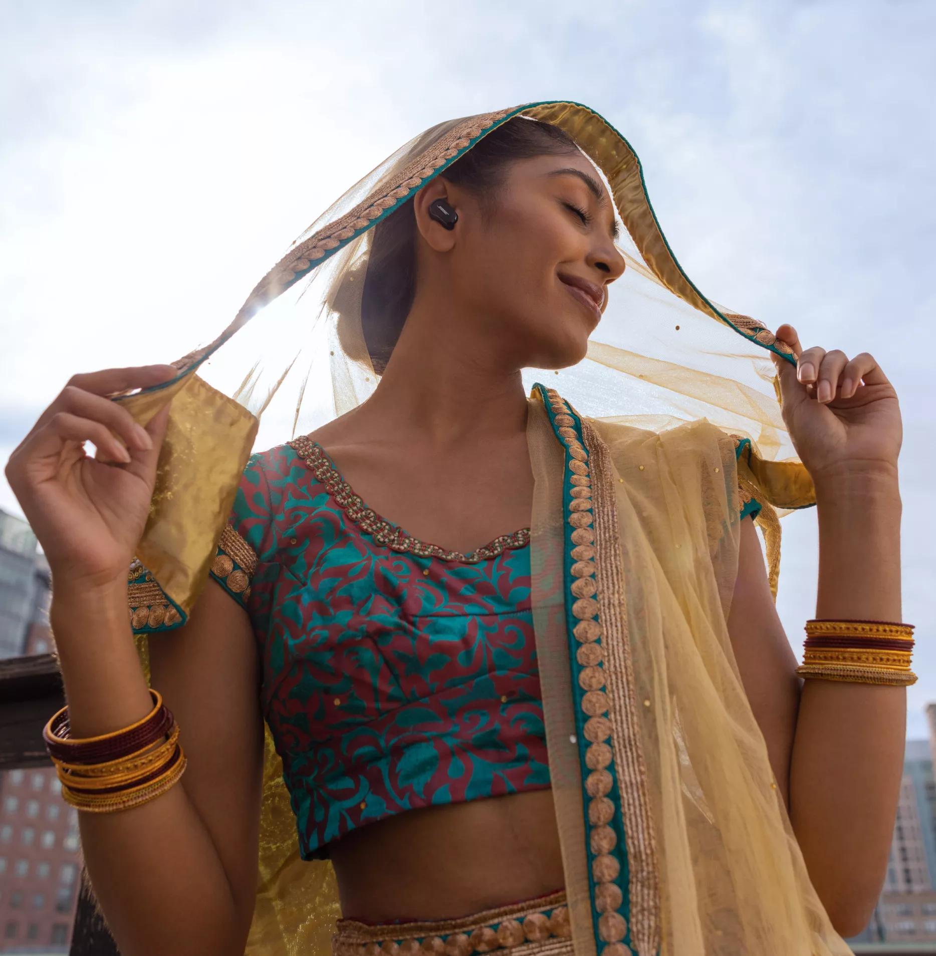 Woman wearing Bose QuietComfort Earbuds II