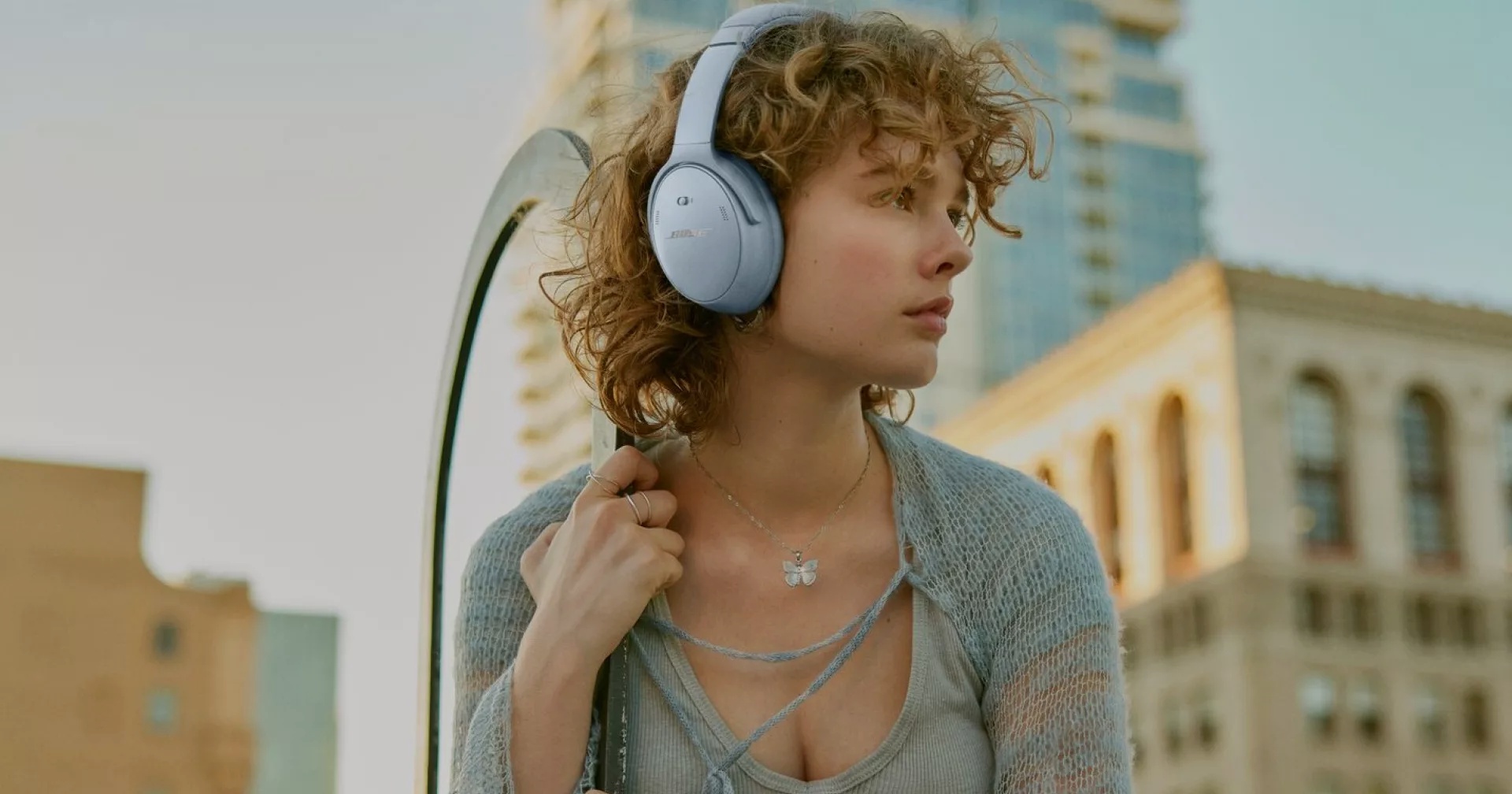 Woman outside with Bose QuietComfort Headphones on
