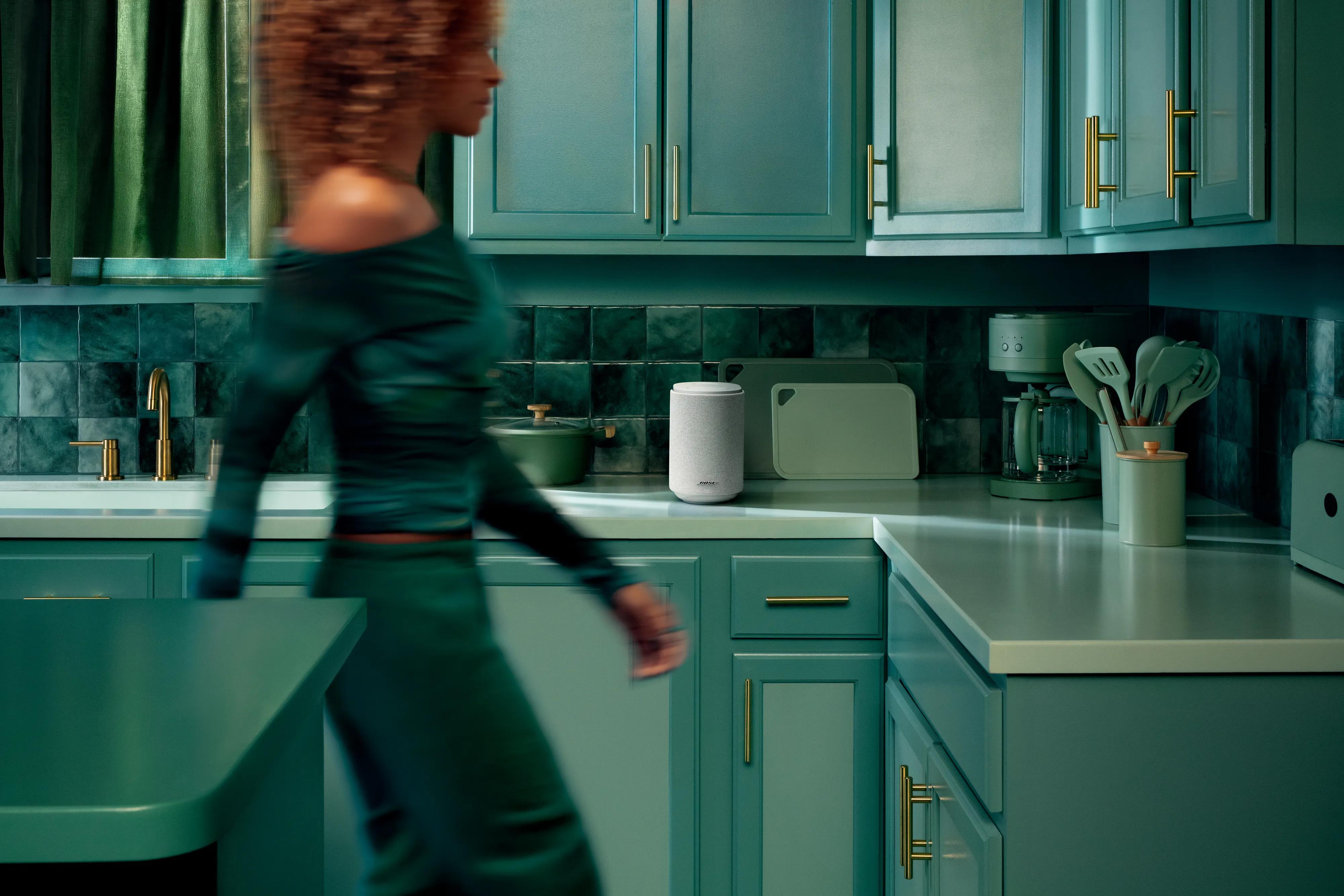 Lifestyle Ultra Speaker in White Smoke on a modern kitchen counter in a stylish home setting.