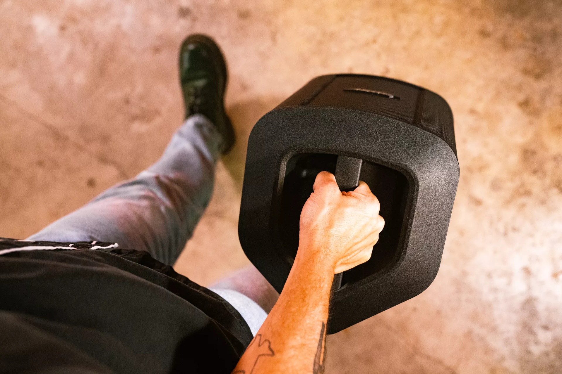 Man carrying the Bose S1 Pro+ Portable Bluetooth Speaker System