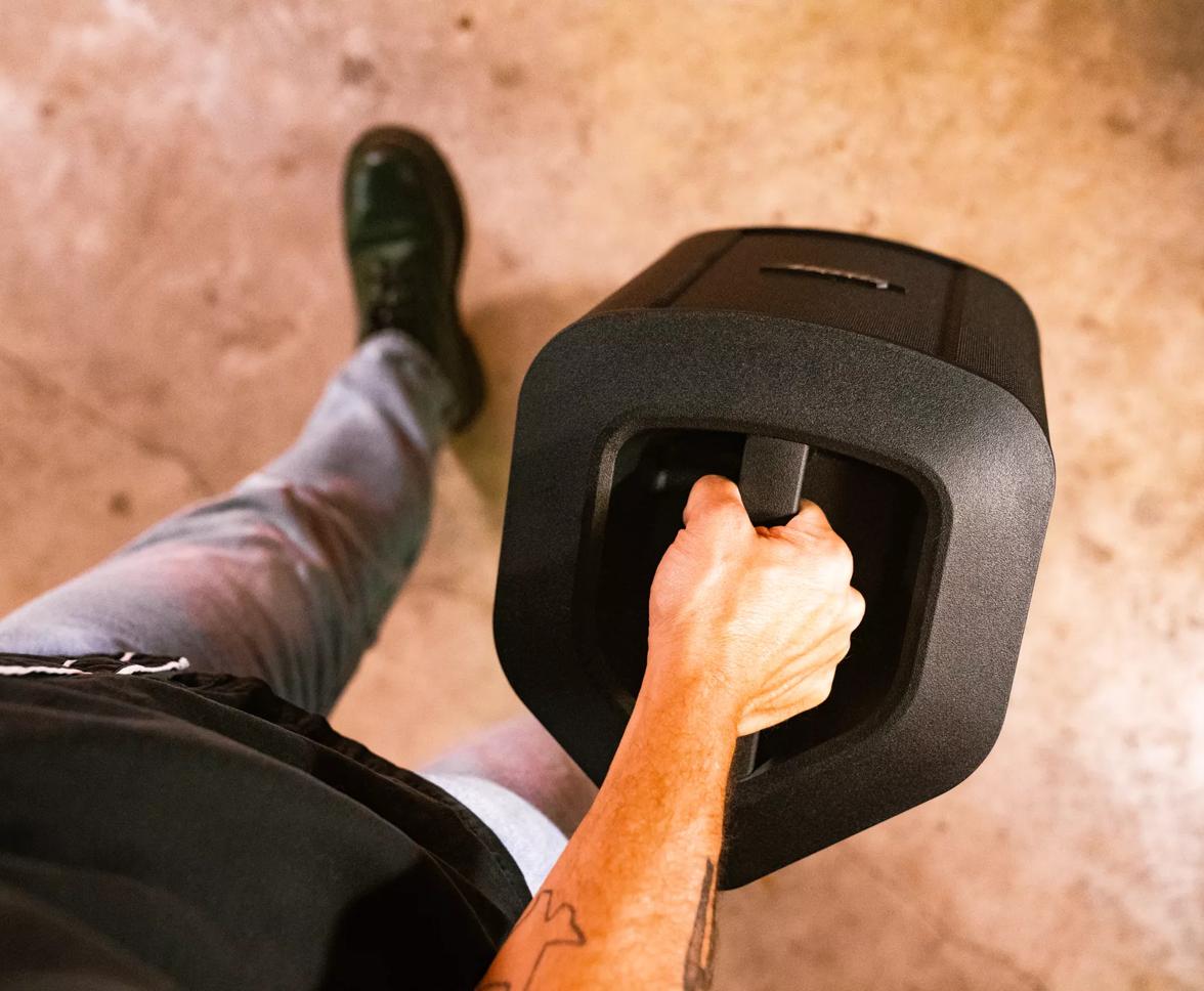 Man carrying the Bose S1 Pro+ Portable Bluetooth Speaker System