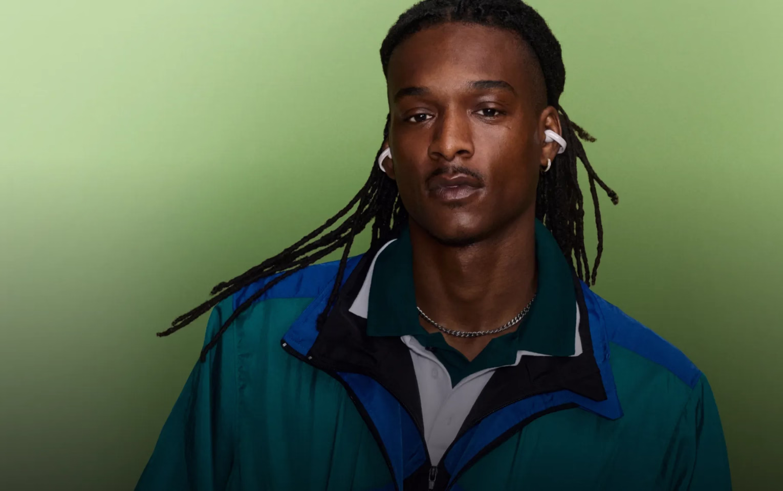 Man wearing Bose Sport Open Earbuds.