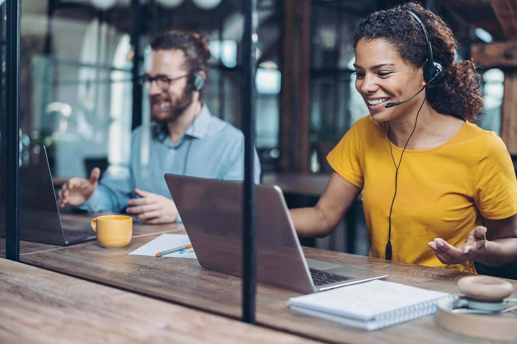 Call center employees working side by side