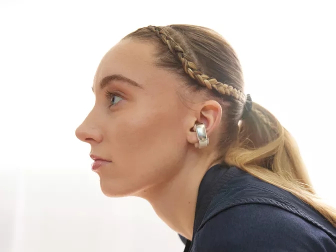 Profile of Paige Bueckers wearing Bose Ultra Open Earbuds