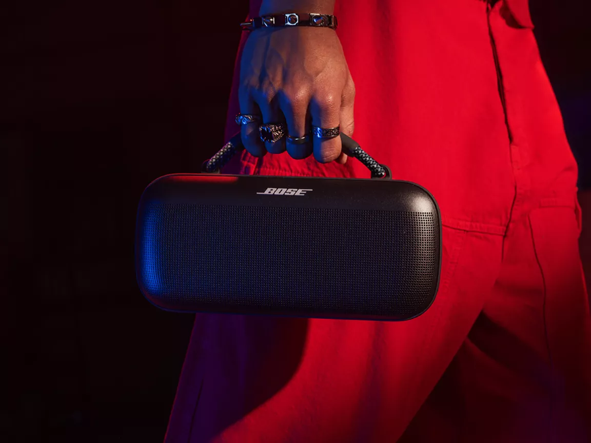Person carrying a Bose SoundLink Max Portable Speaker