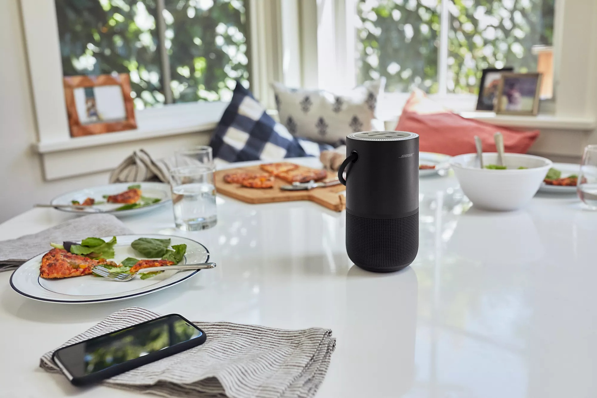 Black Portable Smart Speaker in a white table