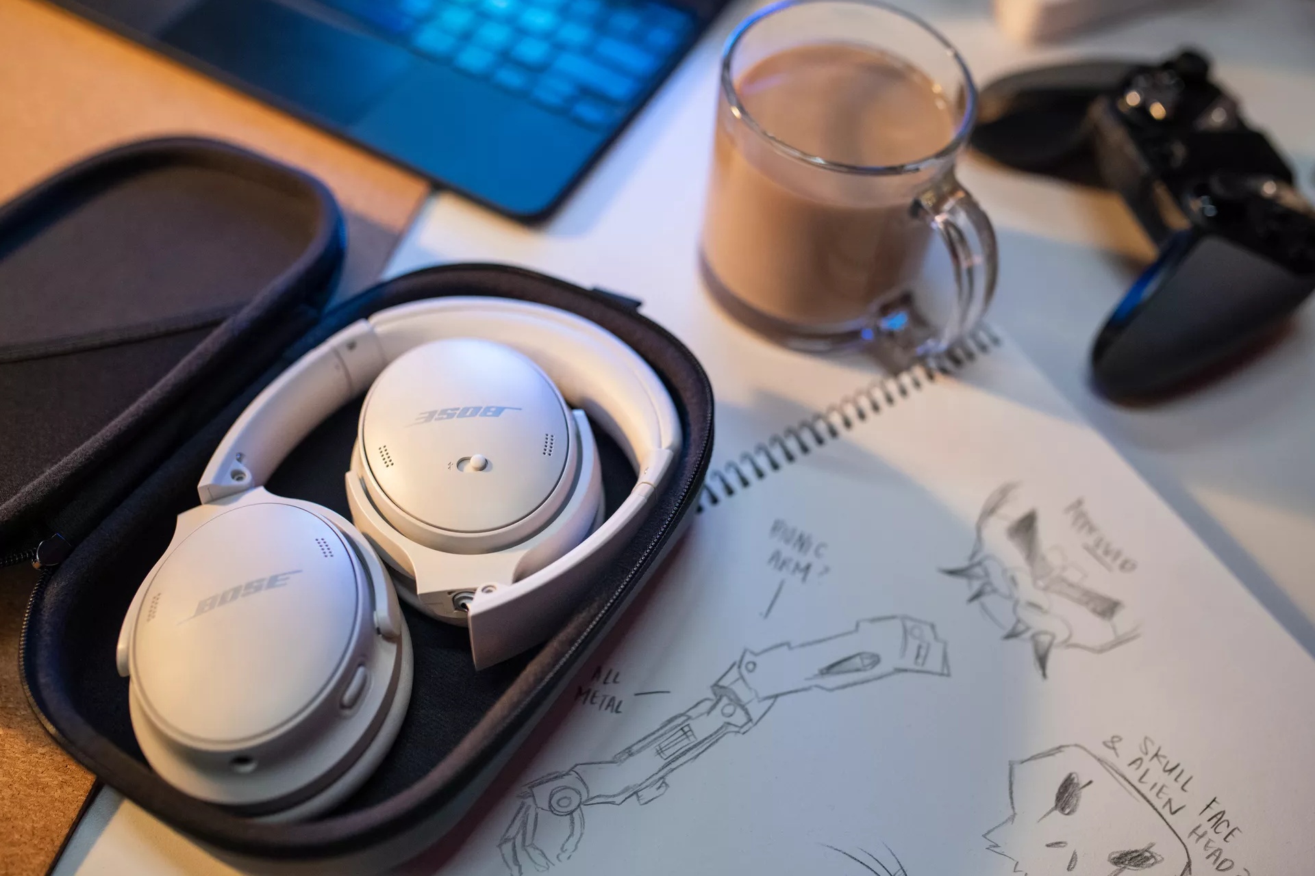 Bose QuietComfort 45 Headphones in their carry case on a desk