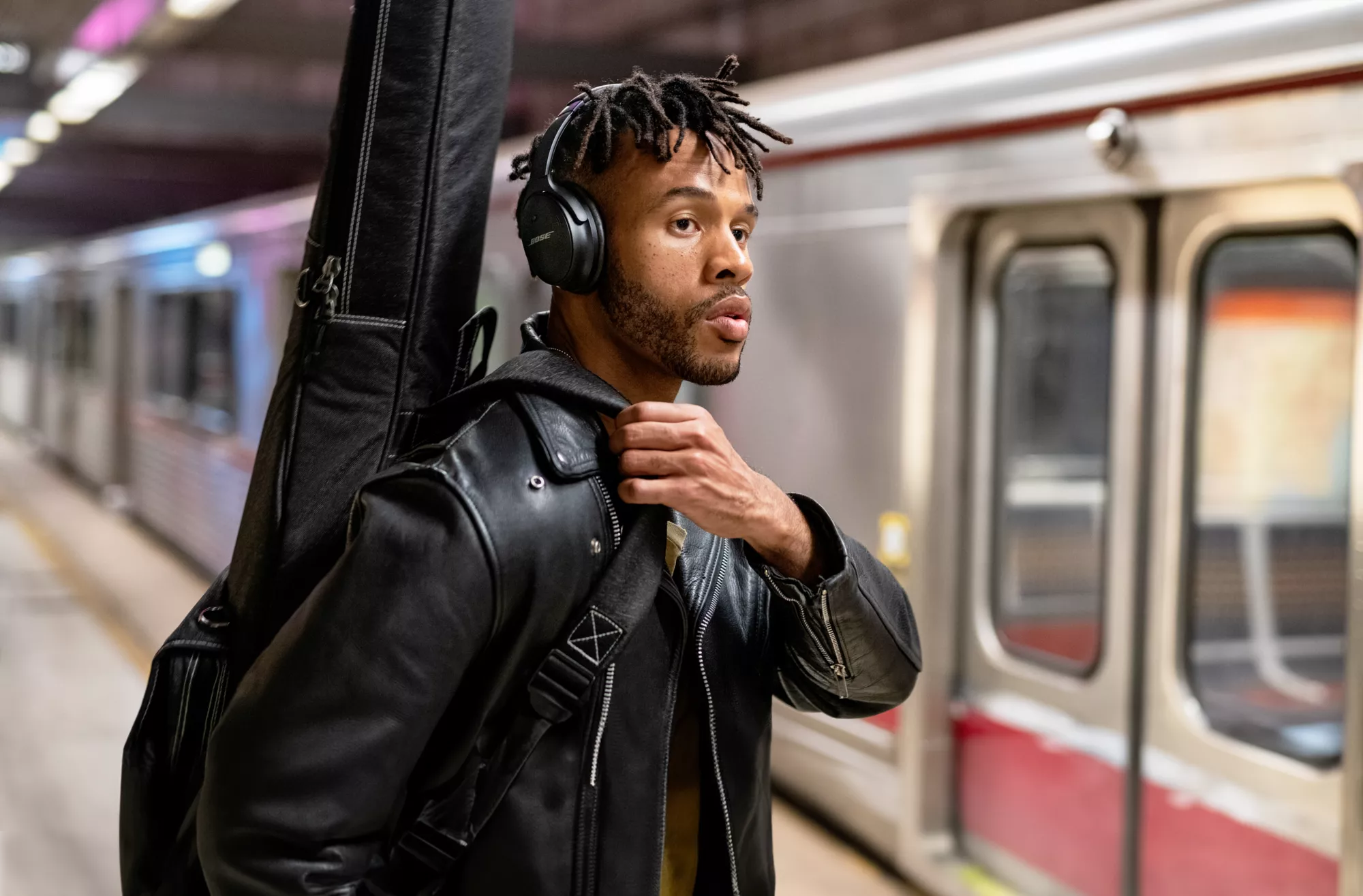 Man using the touch controls on the Refurbished Bose QuietComfort 45 Headphones