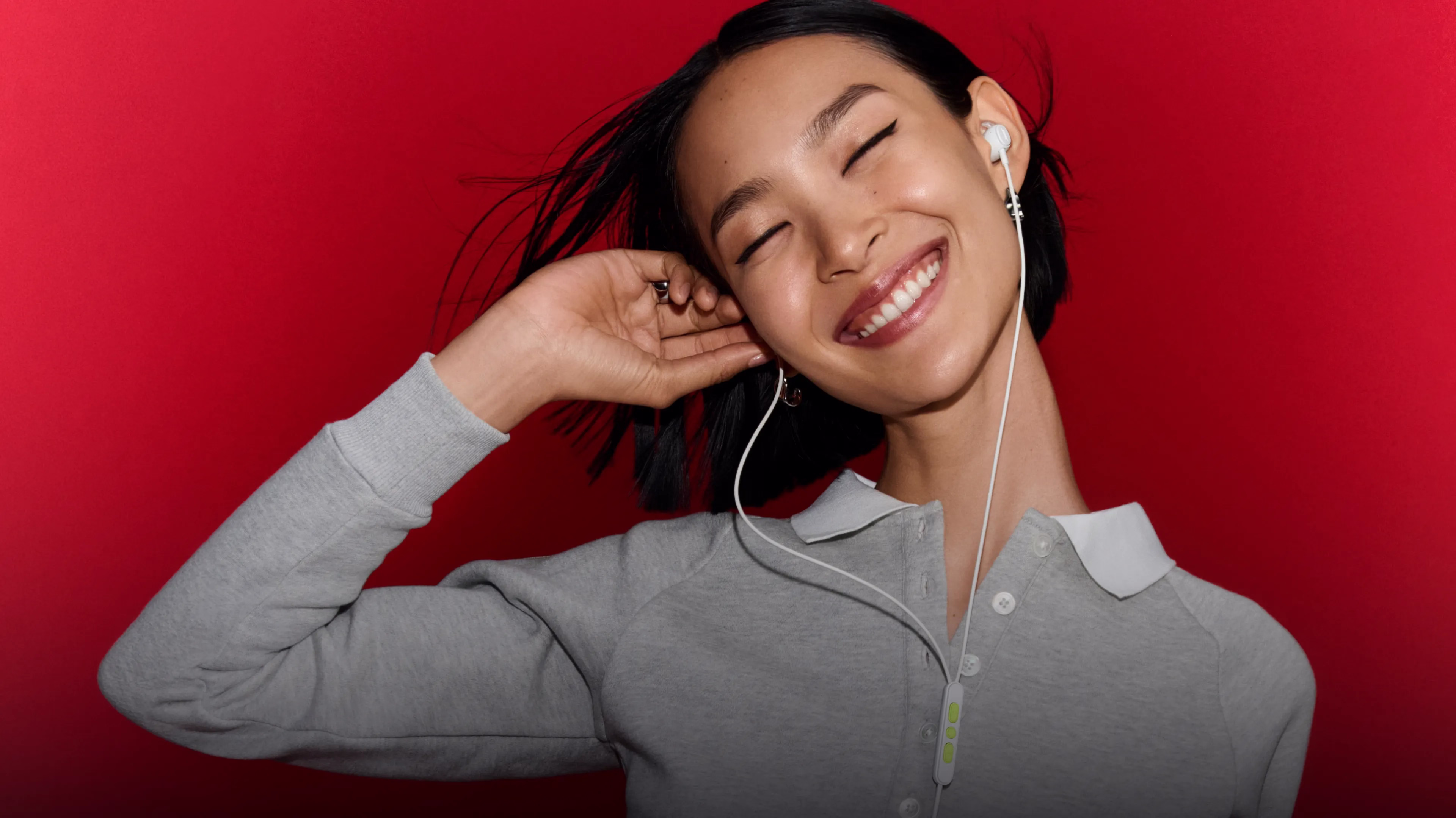 Woman wearing Bose Noise Cancelling Wired Earbuds.