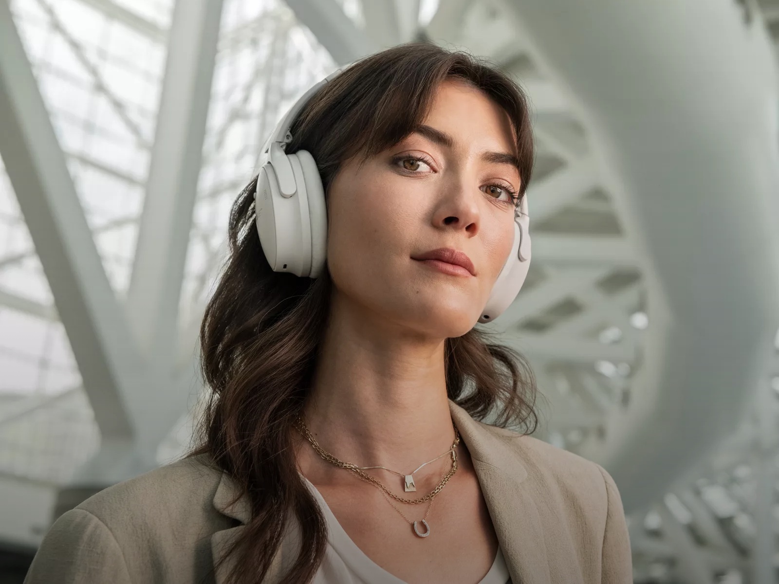 Woman wearing QuietComfort Headphones in an airport