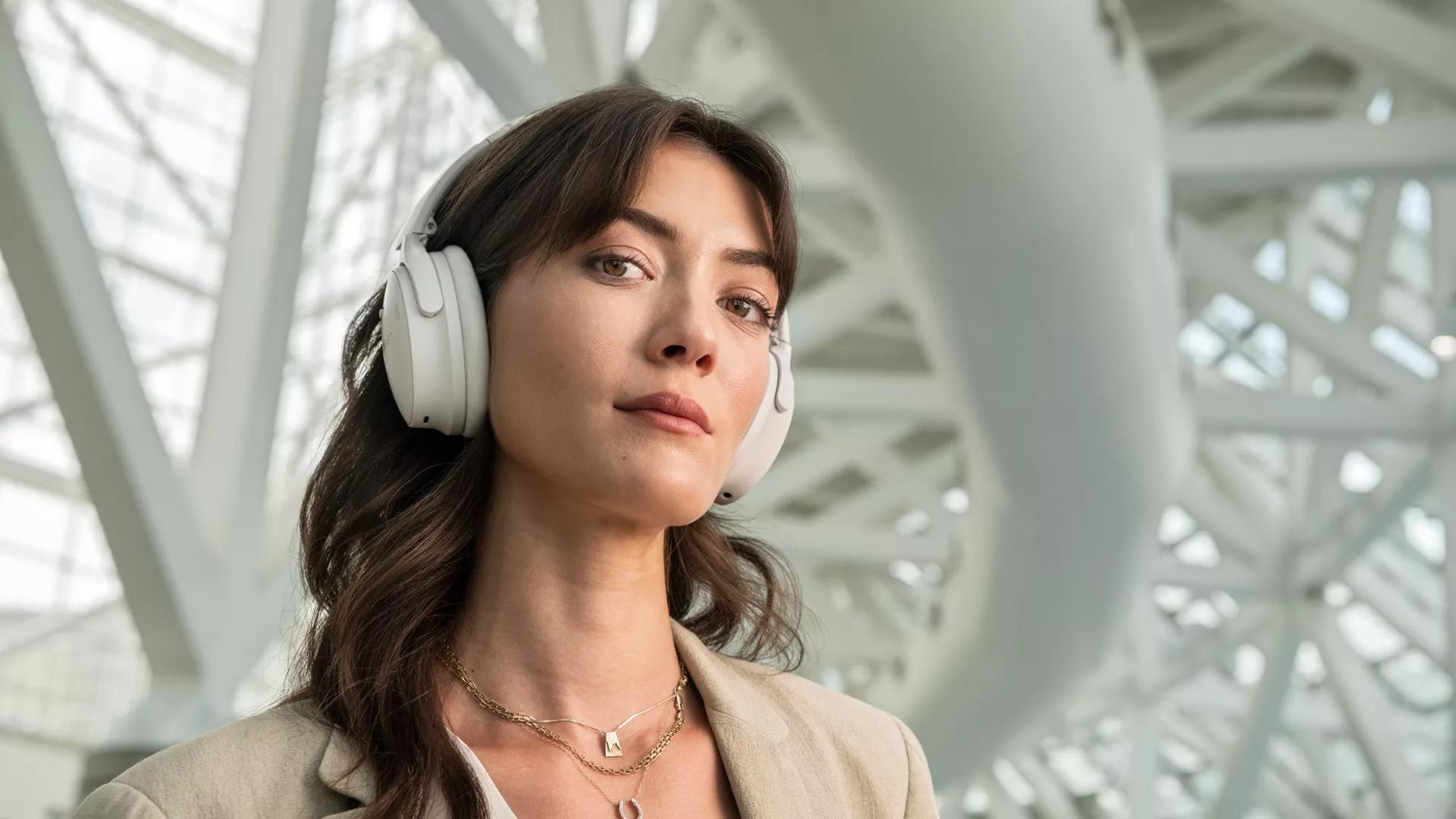 Woman wearing Bose QuietComfort 45 Headphones in an airport