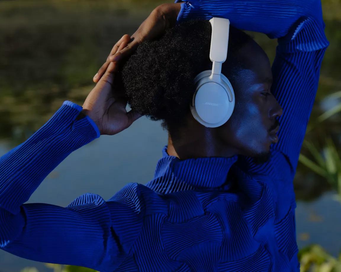 Man wearing Bose QuietComfort Ultra Headphones outside