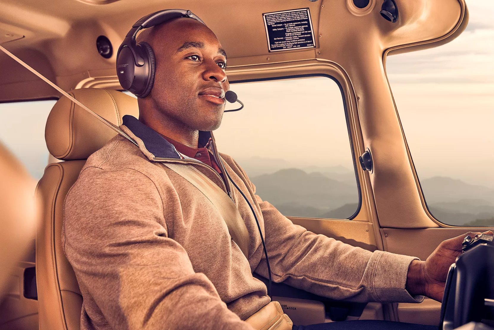 Male pilot wearing the Bose A30 Aviation Headset in an airplane