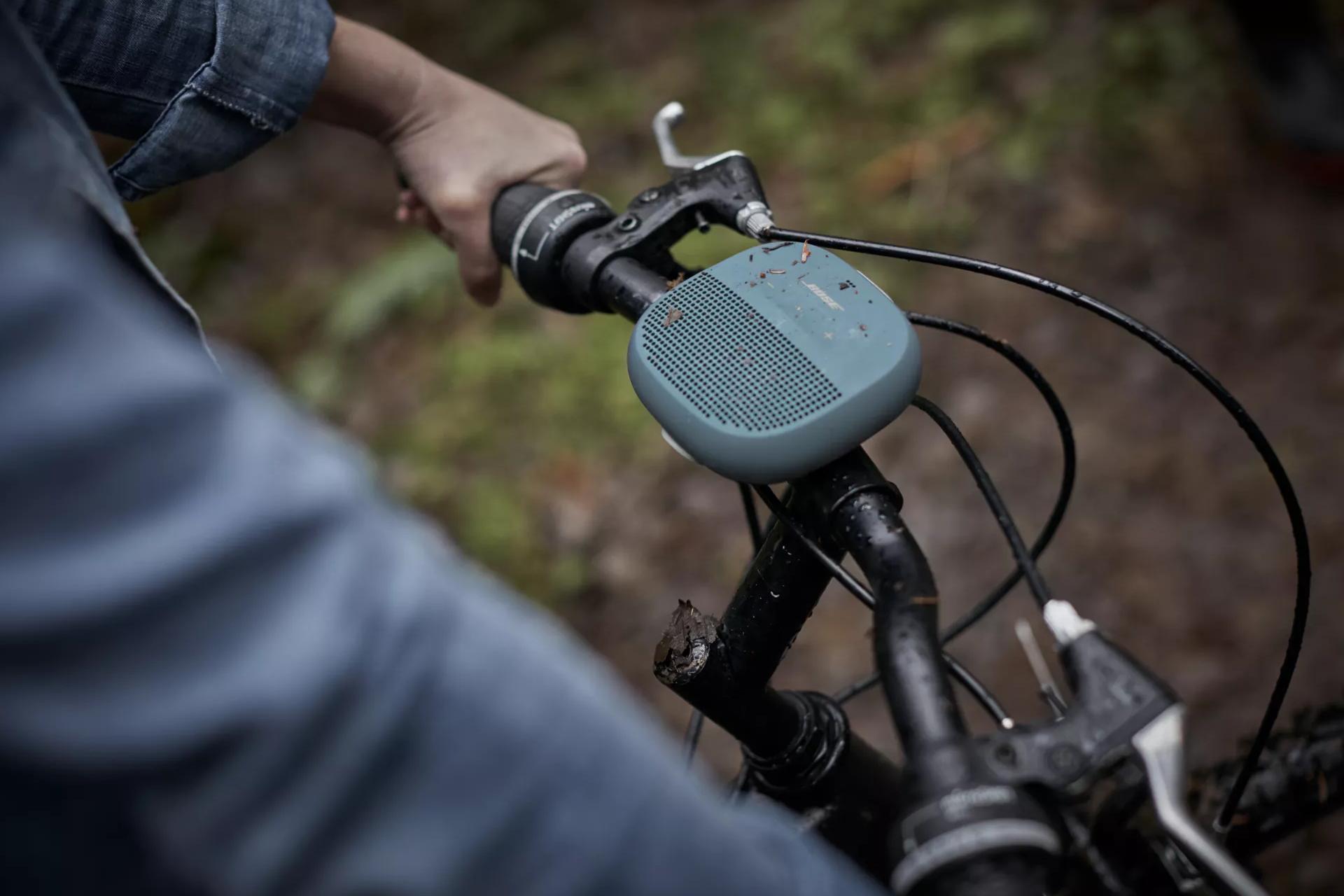 SoundLink Micro Bluetooth Speaker attached to handlebars of a bike