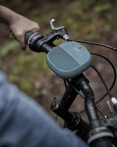 SoundLink Micro Bluetooth Speaker attached to handlebars of a bike
