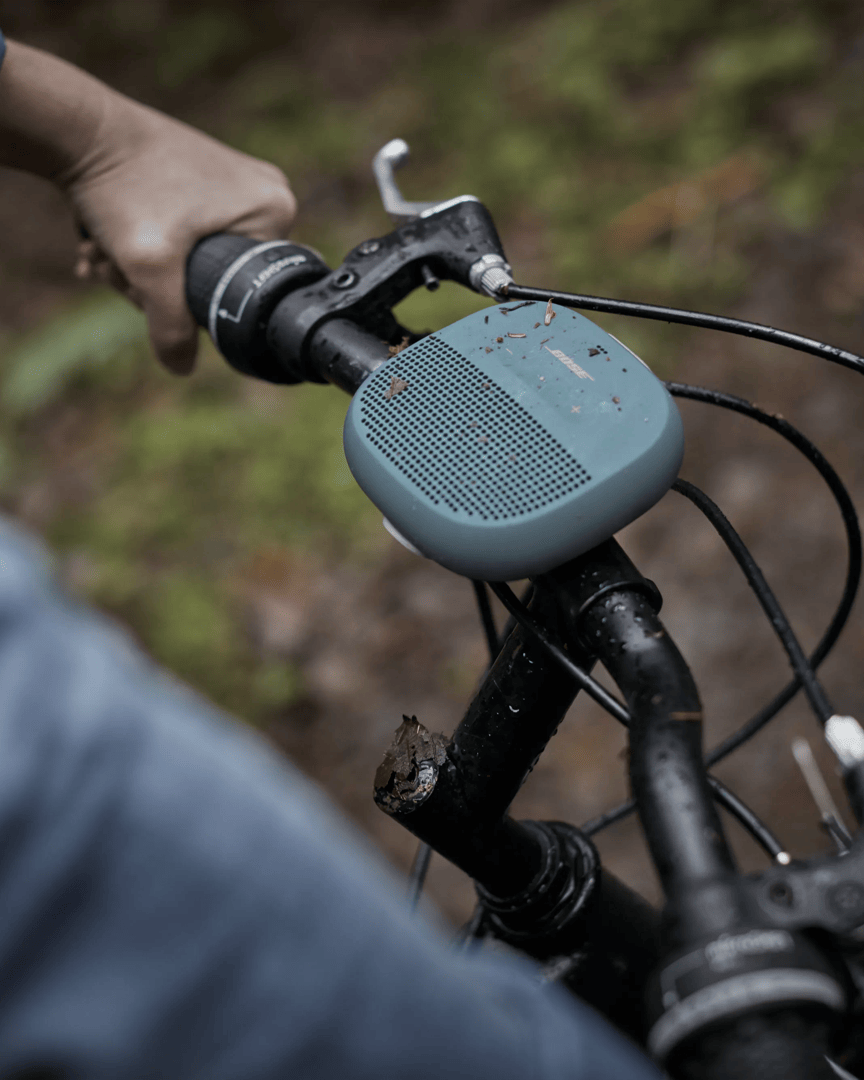 SoundLink Micro Bluetooth Speaker attached to handlebars of a bike