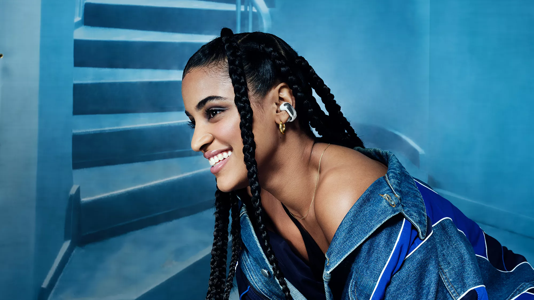 Woman wearing Bose Ultra Open Earbud