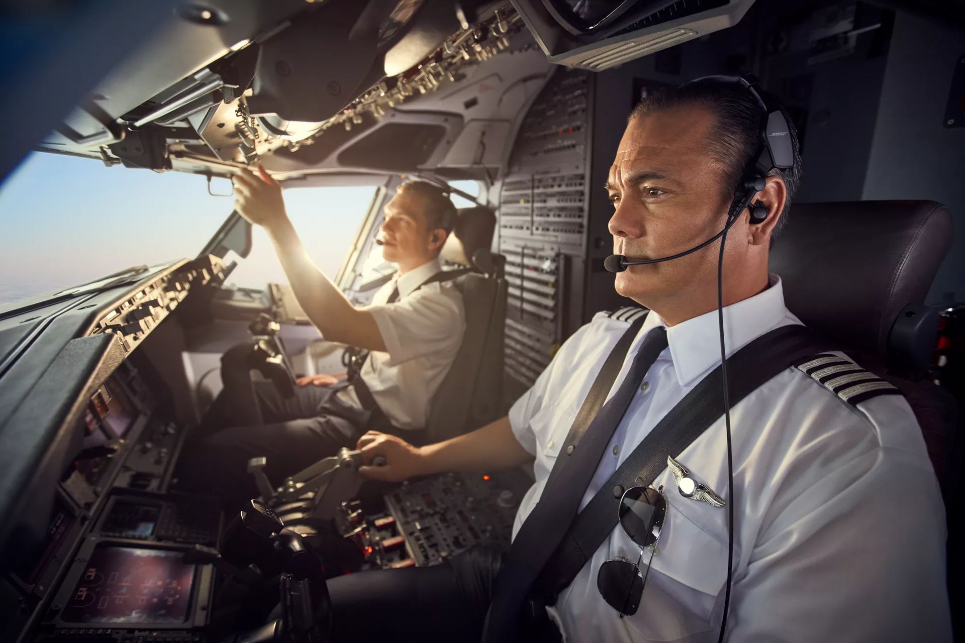 Two pilots wearing ProFlight Aviation Headset Series 2 with sunglare