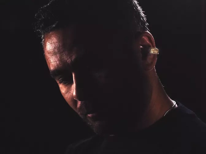 Victor Solomon wearing the exclusive gold-and-diamond encrusted Bose Ultra Open Earbuds