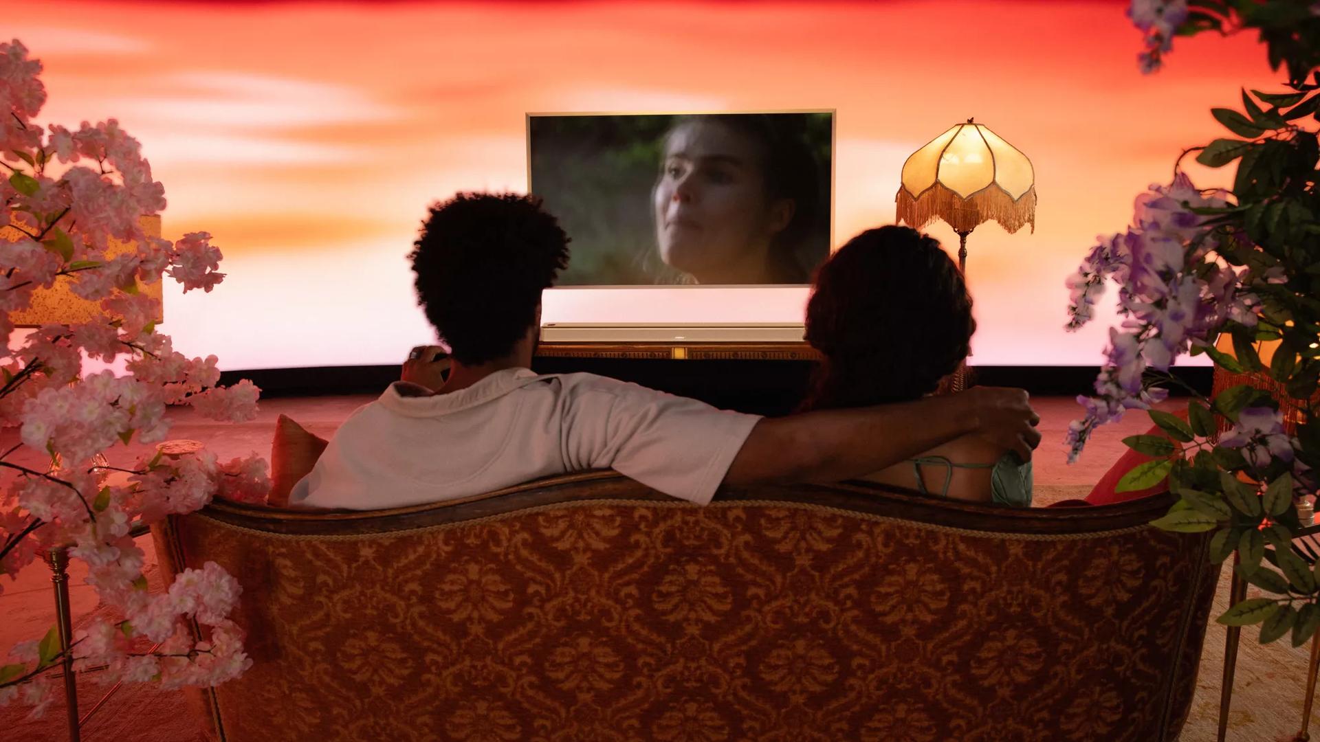 Couple watching TV with a Bose Smart Ultra Soundbar