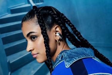 Woman wearing Bose Ultra Open Earbuds