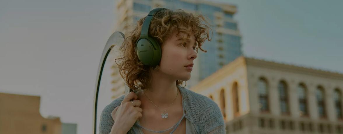 Woman wearing Bose QuietComfort Headphones outside