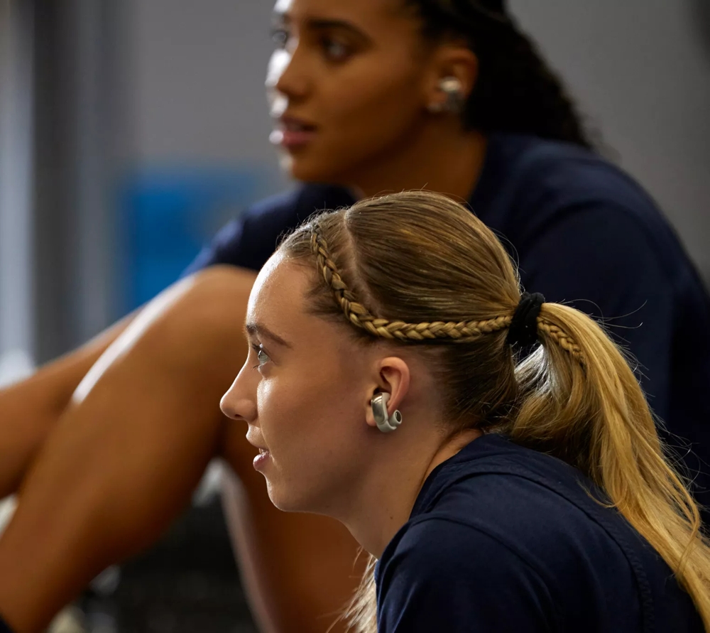 Azzi Fudd and Paige Bueckers wearing Bose Ultra Open Earbuds