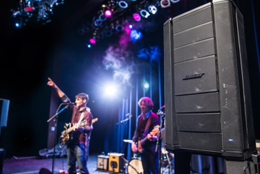 Band performing concert with Bose F1 Model 812 Flexible Array loudspeaker