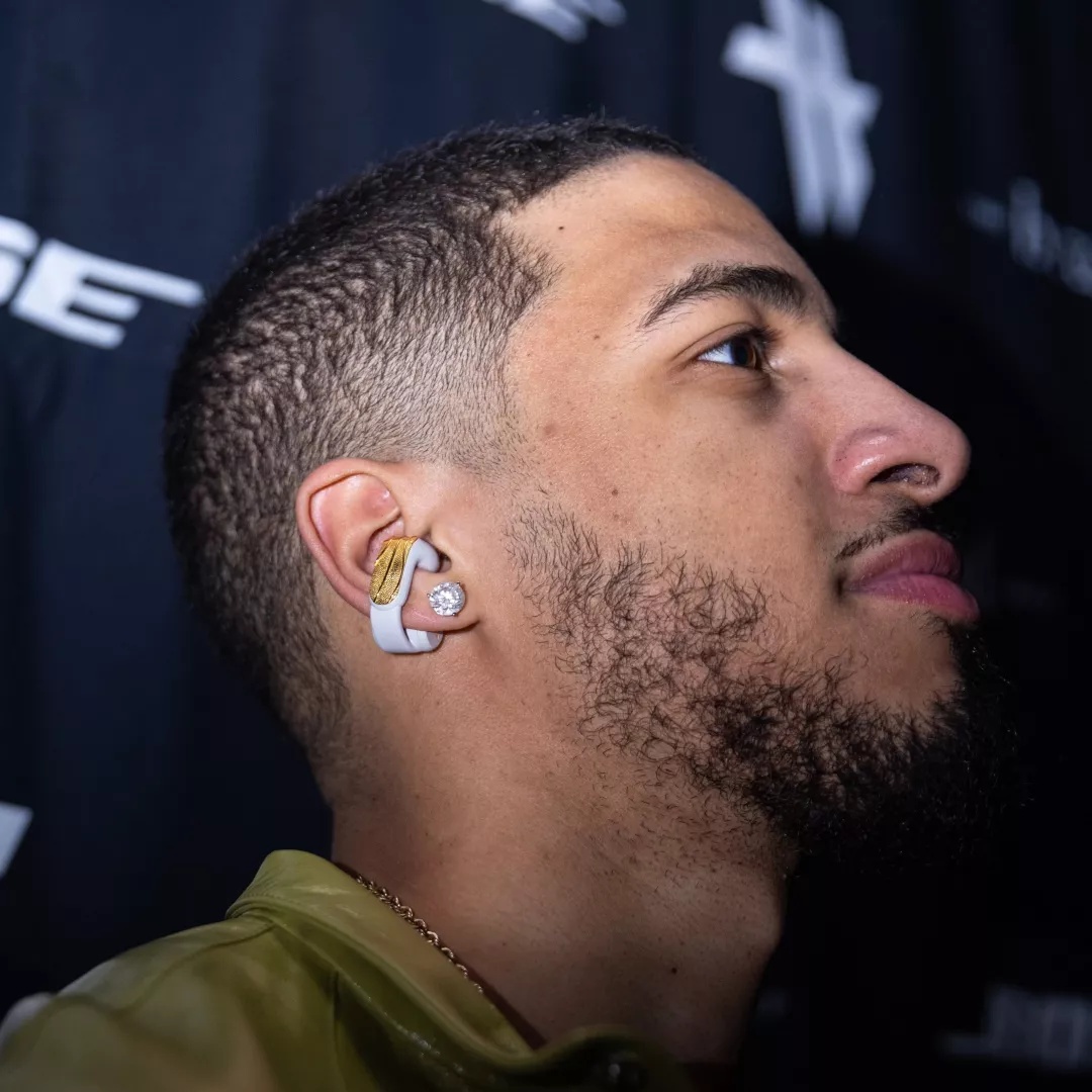 Tyrese Haliburton wearing the custom-designed, Basketball themed Bose Ultra Open Earbuds