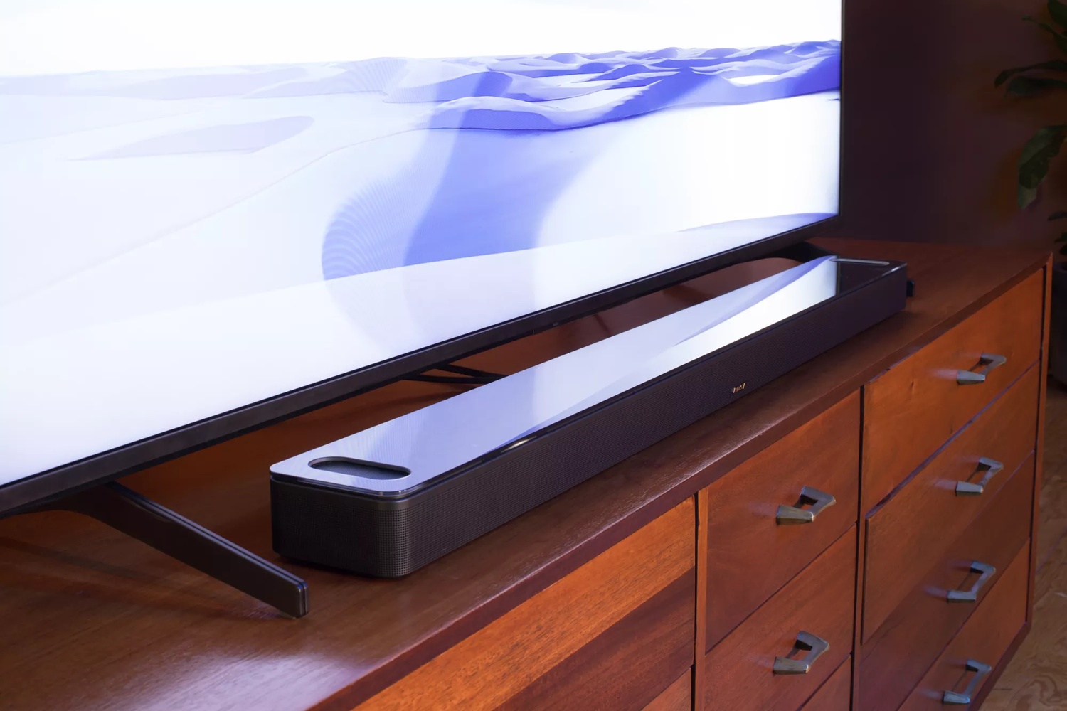 Bose Smart Soundbar 900 sitting on console in front of TV
