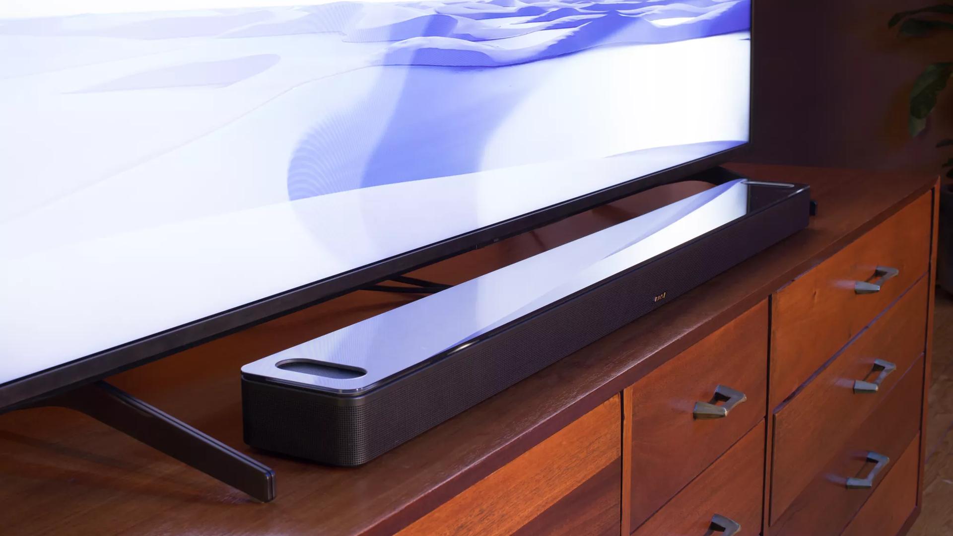 Bose Smart Soundbar 900 sitting on console in front of TV