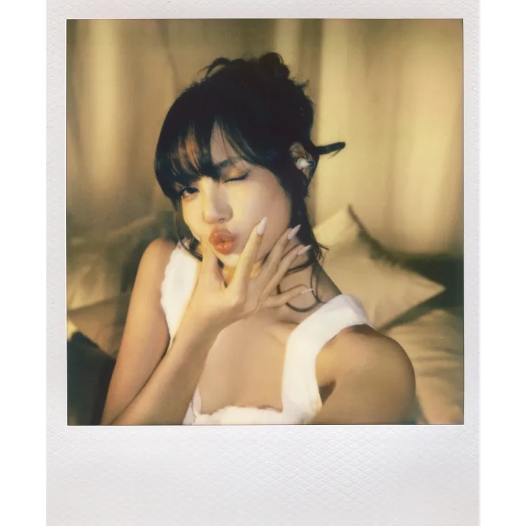 LISA wearing her special Crystal Edition of the Bose × LISA Ultra Open Earbuds.