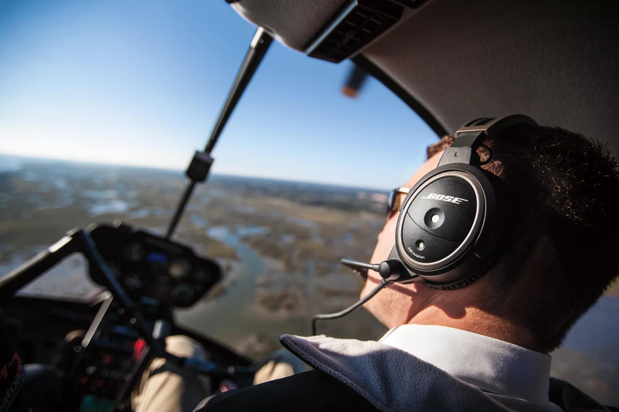 Male pilot wearing Bose A20 Aviation Headset during flight