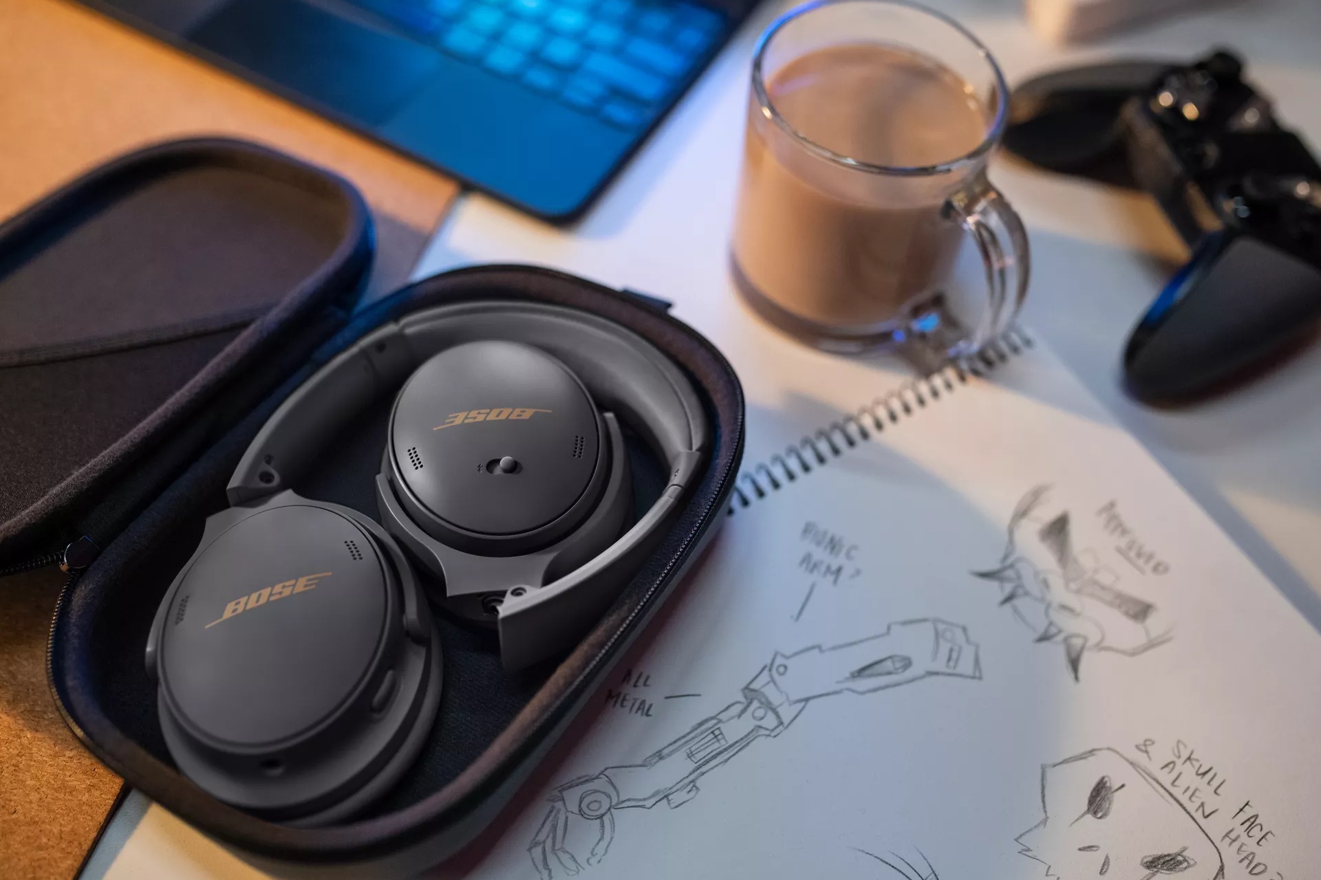 Bose QuietComfort 45 Headphones in their carry case on a desk