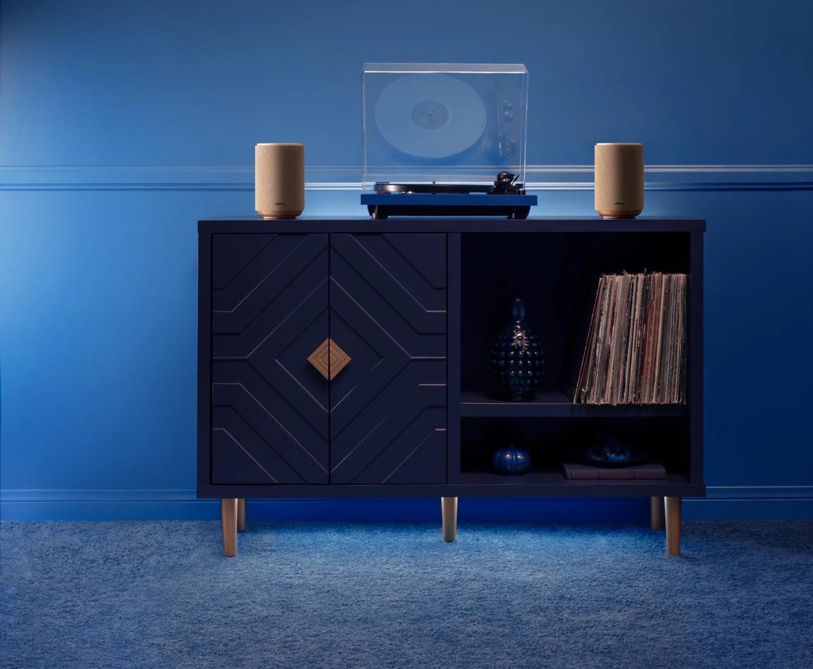 Woman wearing Bose Ultra Open Earbuds