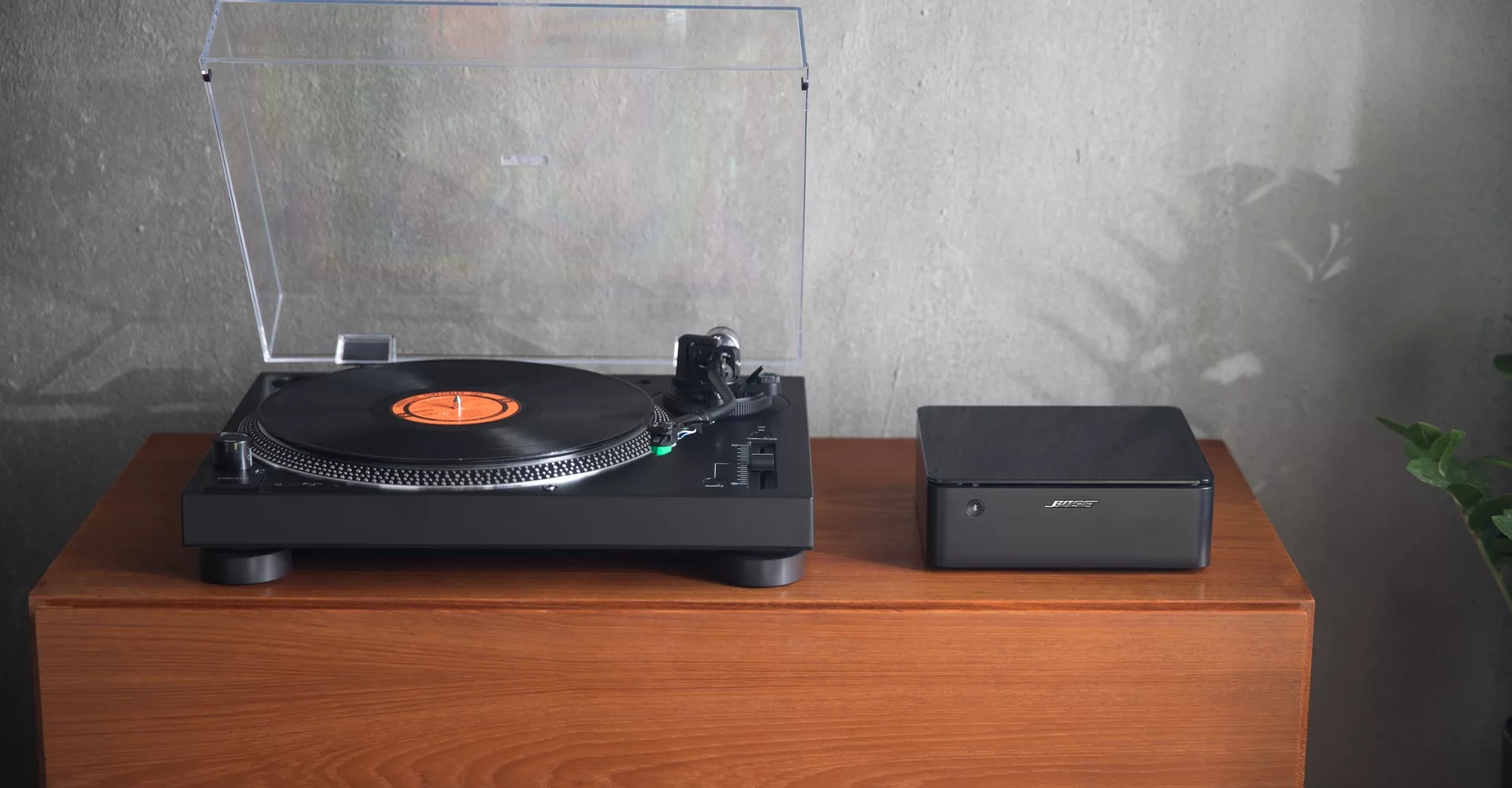 Bose Music Amplifier powering vinyl record player in living room