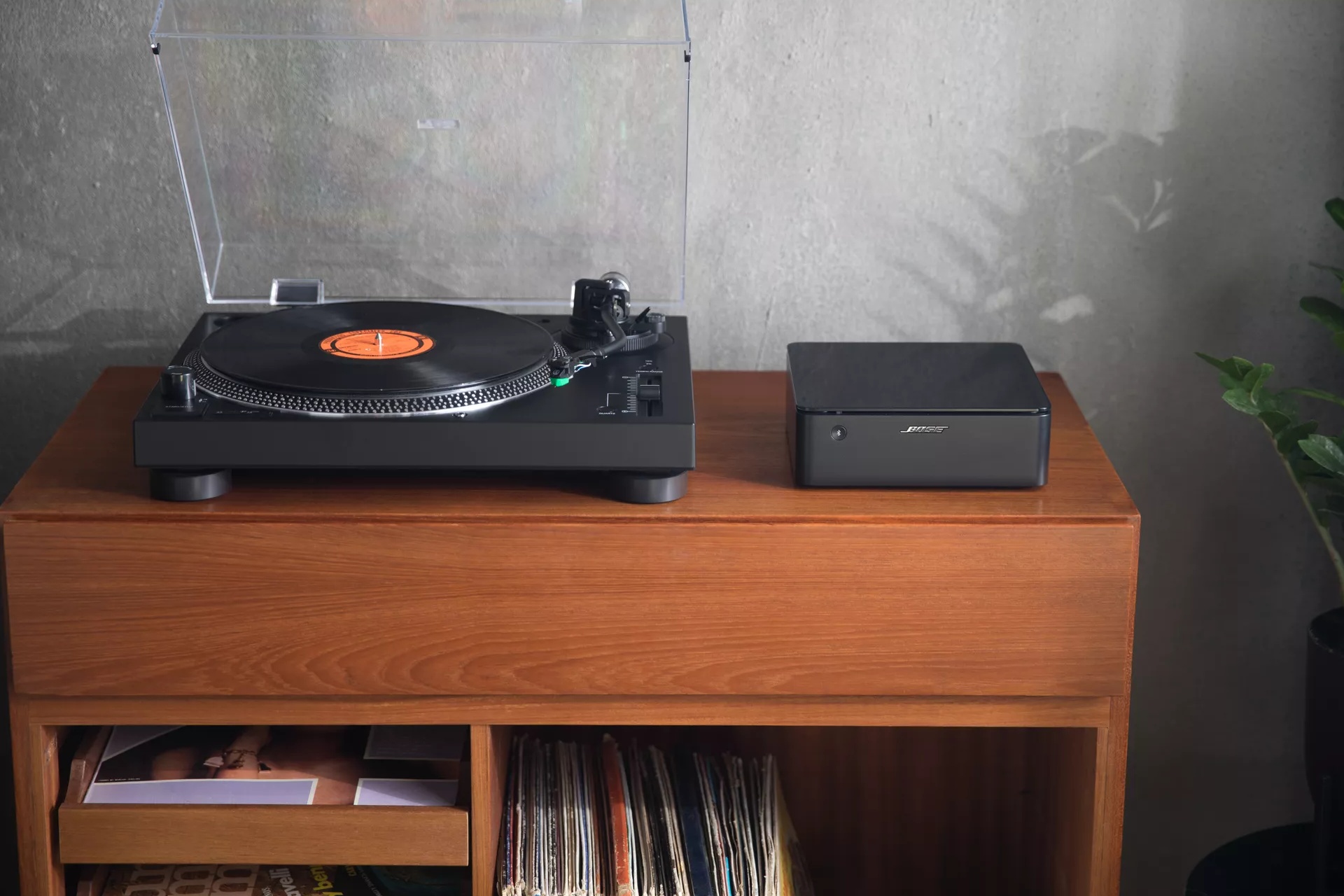 Bose Music Amplifier on a table with a turntable