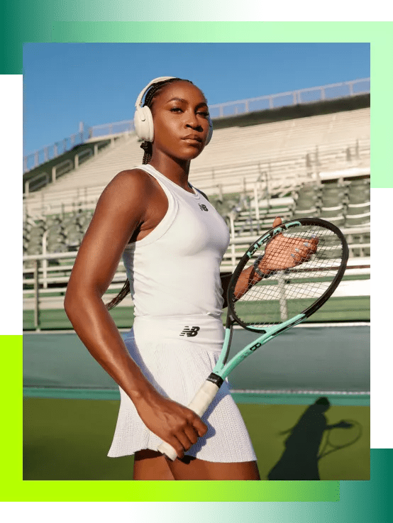 Coco Gauff wearing Bose QuietComfort 45 Headphones on a tennis court