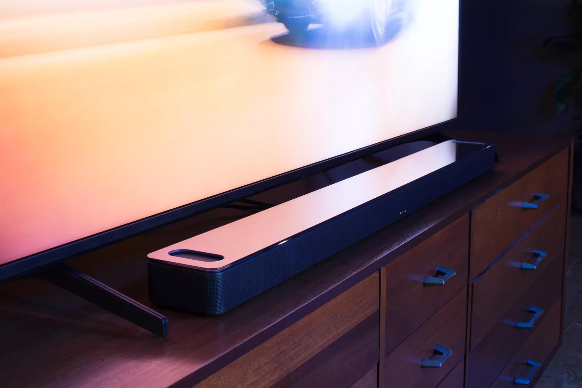 Bose Smart Ultra Soundbar on media console in front of flatscreen TV 