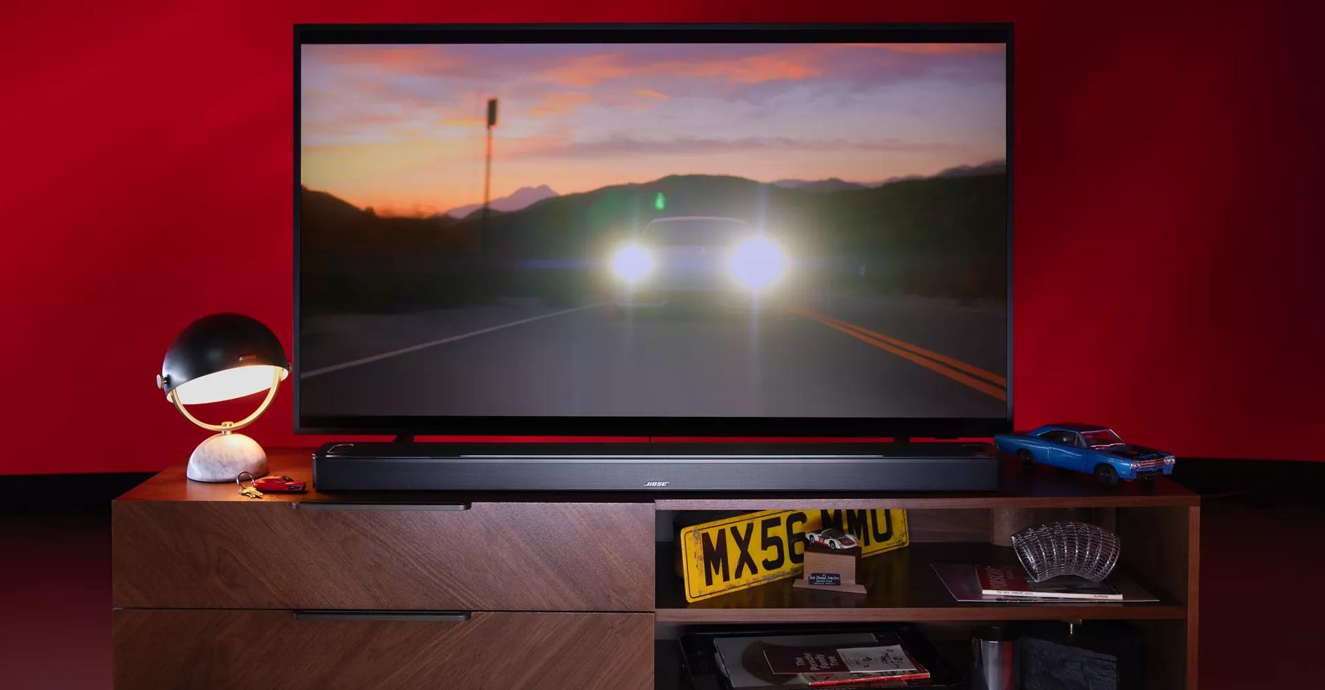 Bose Smart Ultra Soundbar with a TV on a TV stand