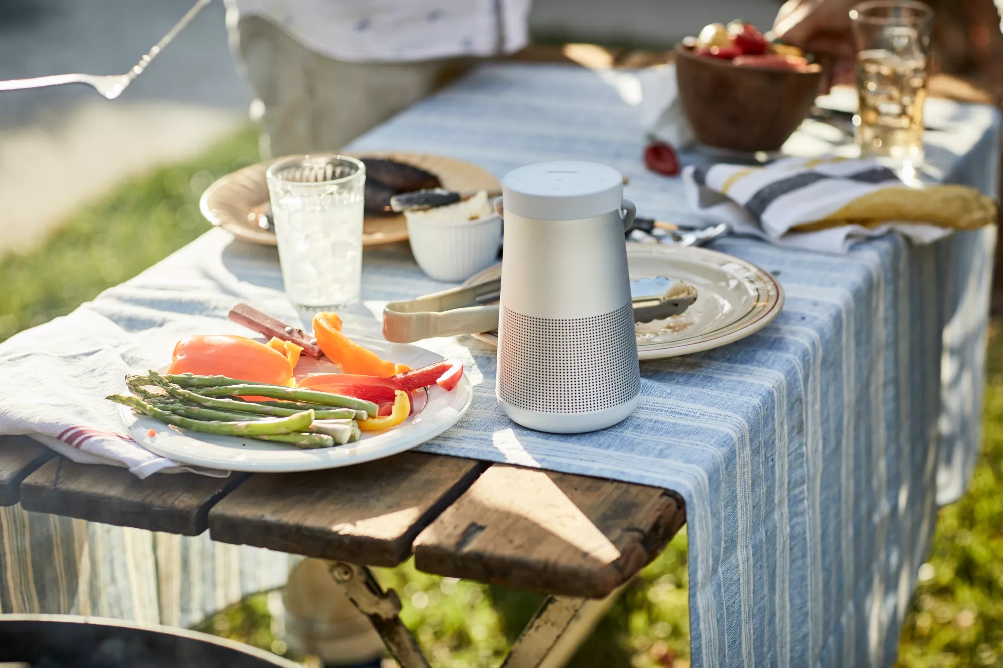 Bose SoundLink Revolve+ II Bluetooth Speaker on a table outside