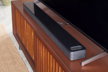 Bose Smart Ultra Soundbar on a TV stand in a living room