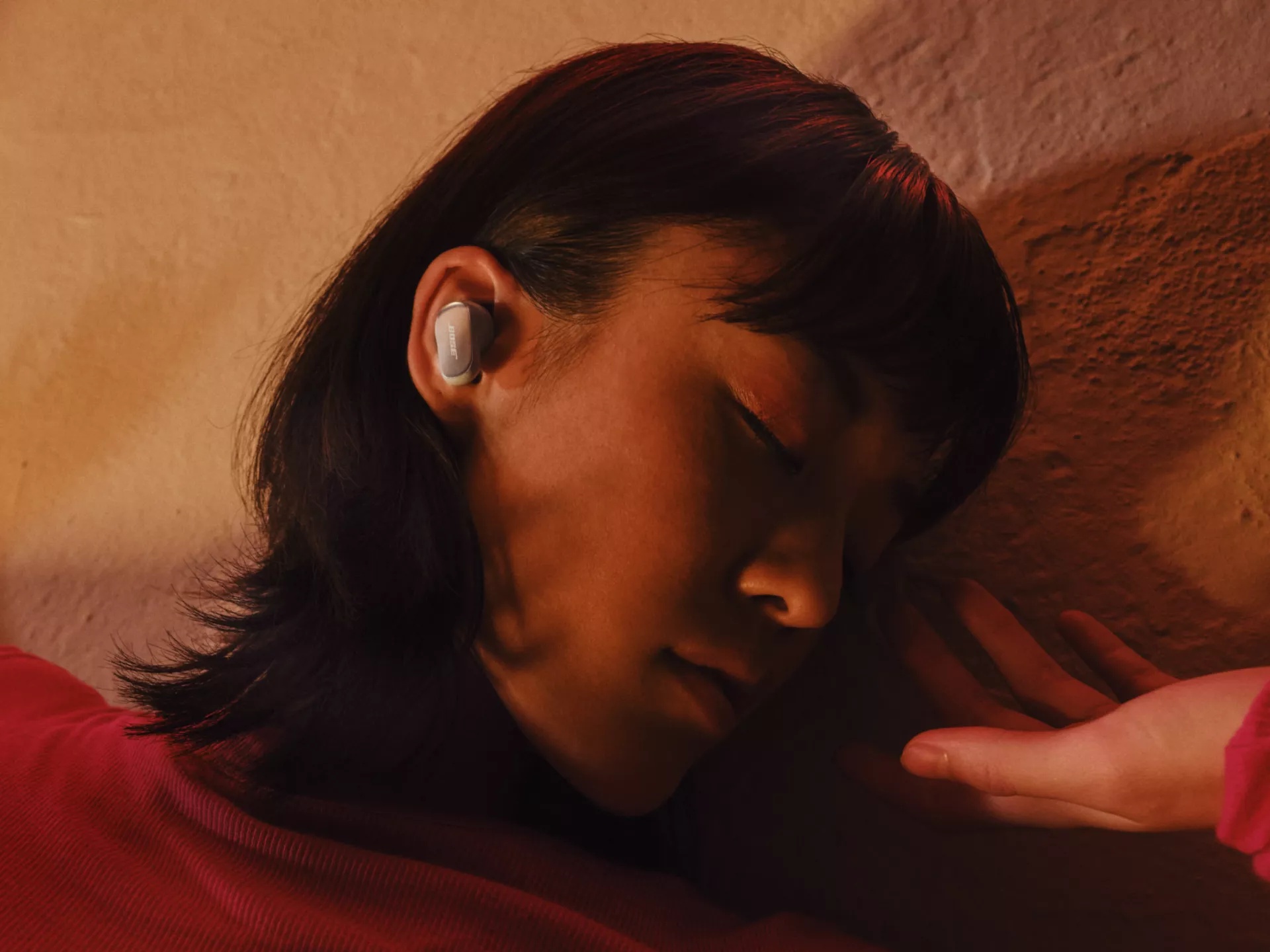 Woman dancing freely while listening to wireless QuietComfort Ultra Earbuds