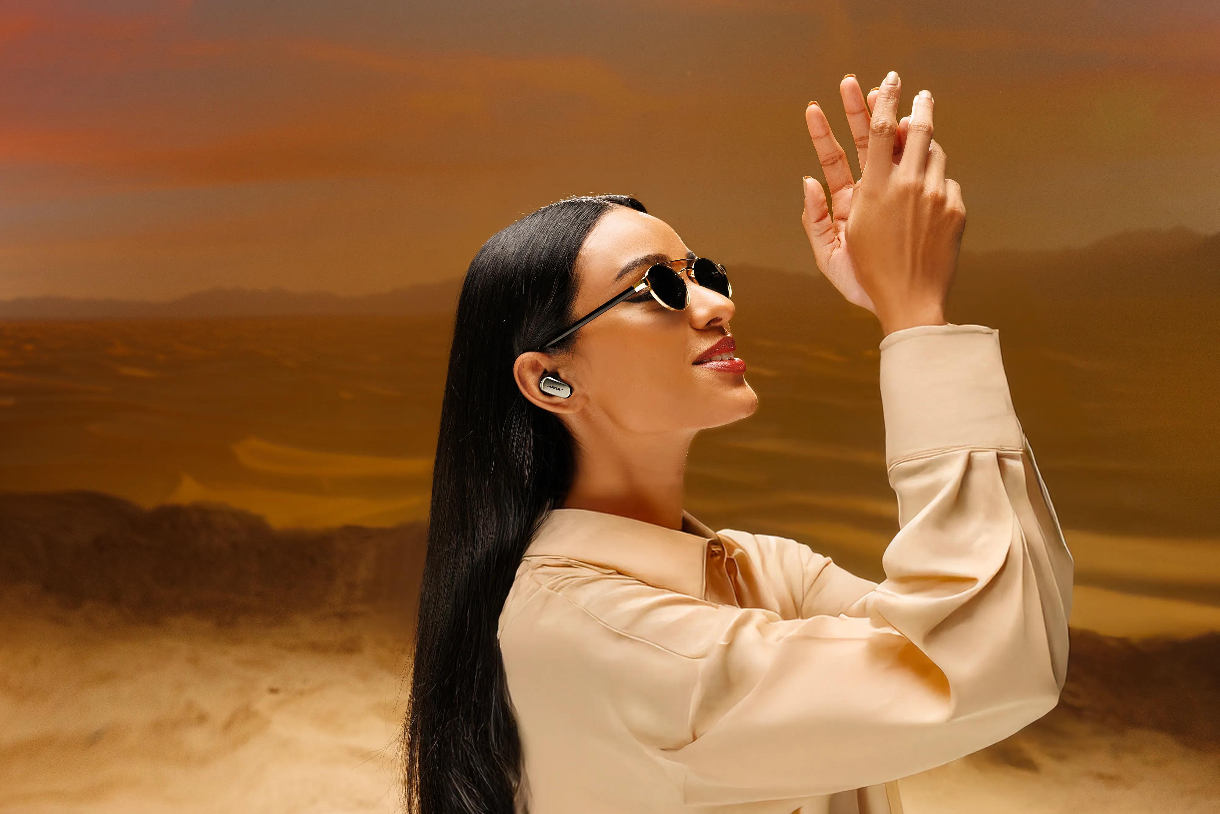 Woman wearing Bose QuietComfort Ultra Earbuds (2nd Gen).