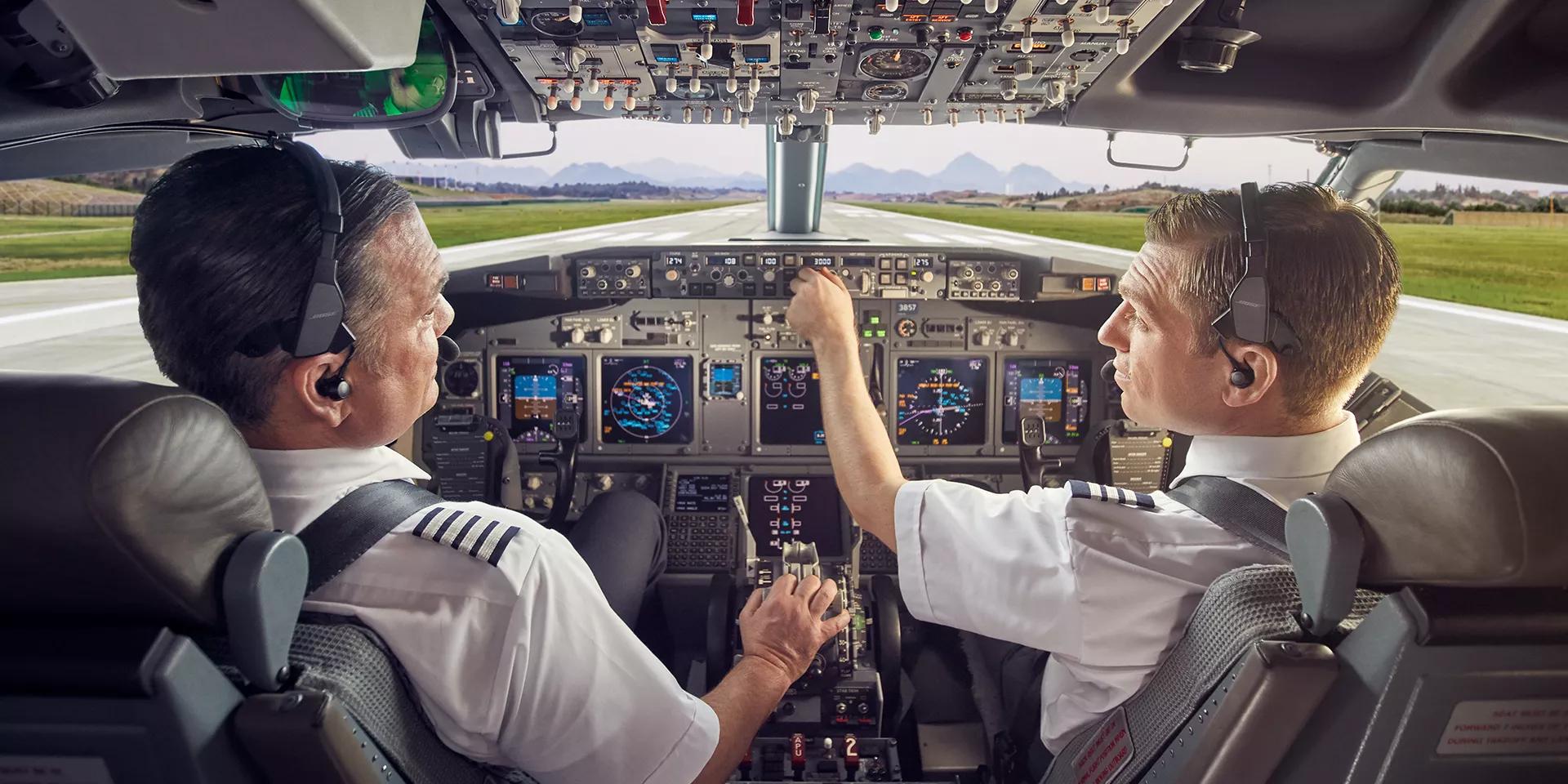 Pilots wearing ProFlight Aviation Headset Series 2 using controls