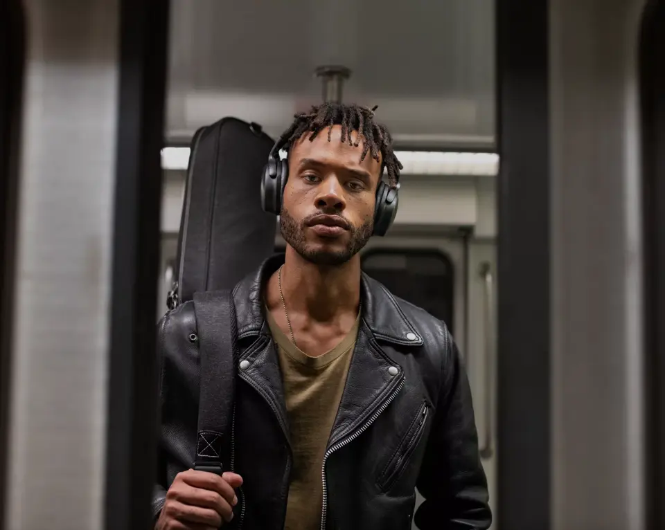 Man on subway wearing QuietComfort 45 Headphones 