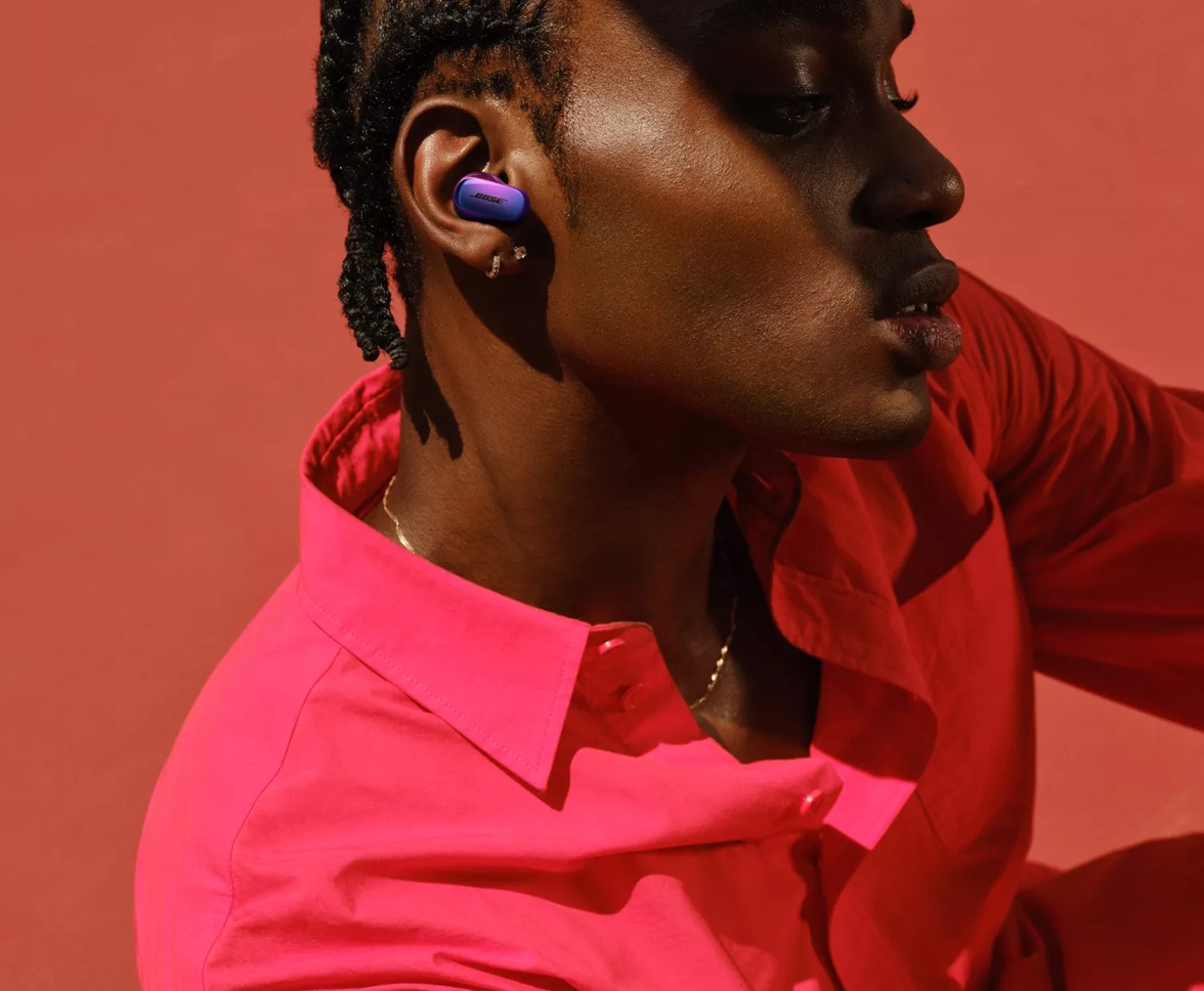 Man wearing customized Bose QuietComfort Ultra Earbuds