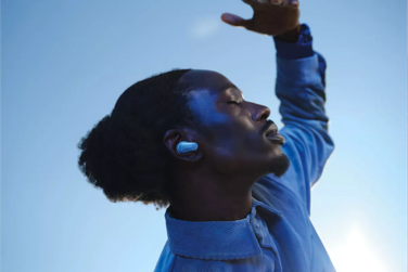 Man outside wearing Bose QuietComfort Ultra Earbuds