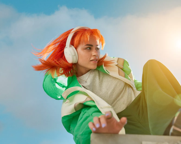 Woman wearing Bose QuietComfort Headphones outside